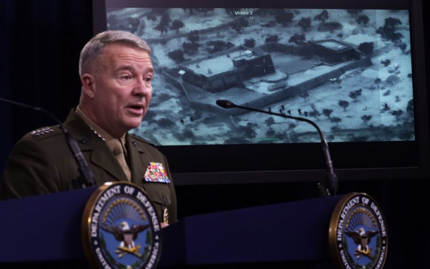 ARLINGTON, VIRGINIA - OCTOBER 30: U.S. Marine Corps Gen. Kenneth McKenzie, commander of U.S. Central Command, speaks as a picture of the operation targeting Abu Bakr al-Baghdadi is seen during a press briefing October 30, 2019 at the Pentagon in Arlington, Virginia. Gen. McKenzie and Hoffman spoke to the media to provide an update on the special operations raid that targeted former ISIS leader Abu Bakr al-Baghdadi in Idlib Province, Syria.   Alex Wong/Getty Images/AFP
